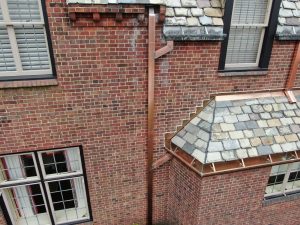 slate roof on bump out and copper downspouts